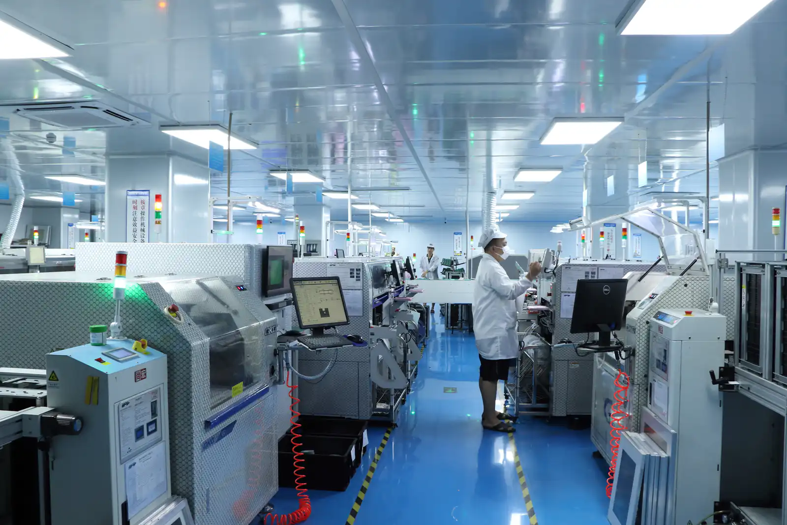 Benlida SMT PCB assembly production line with operators monitoring automated equipment