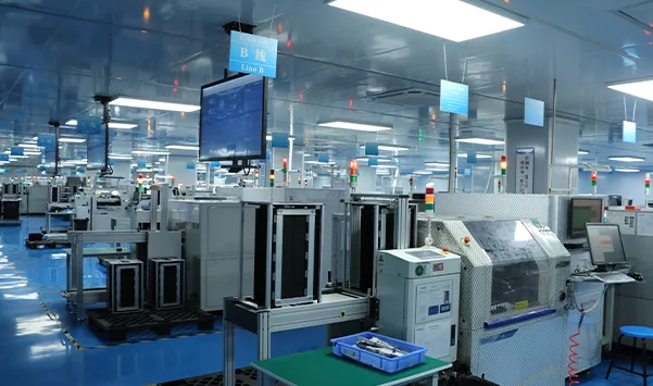 PCB assembly production floor with rows of equipment
